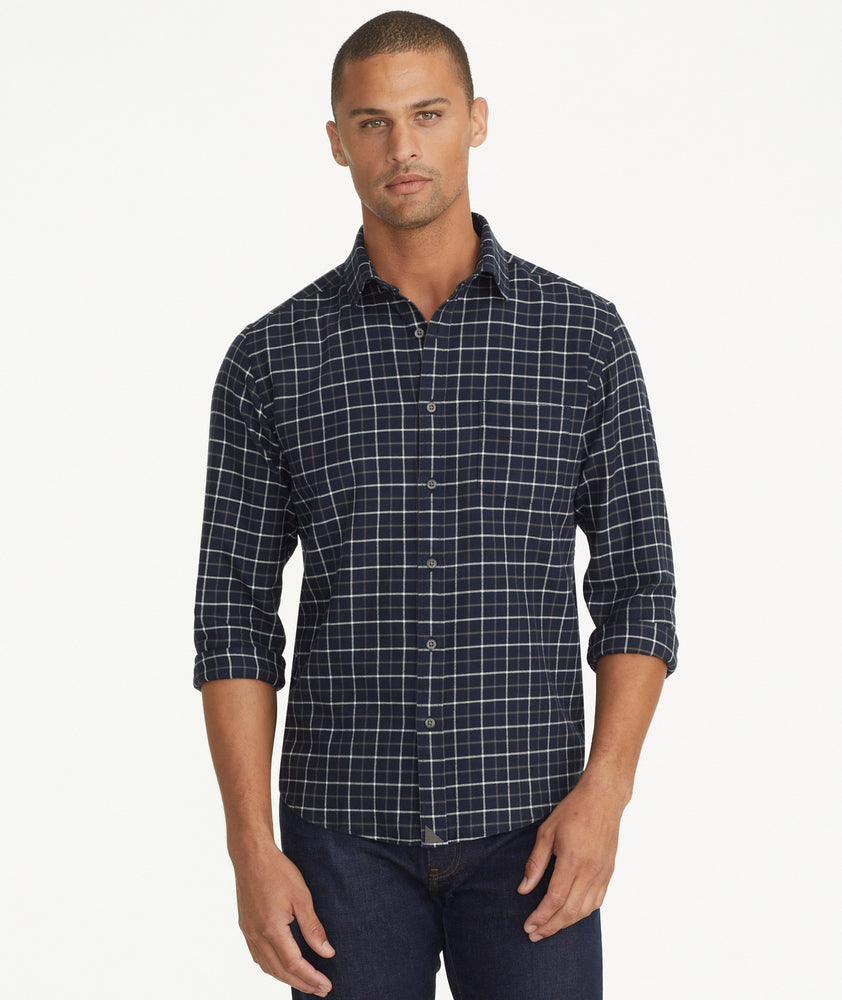 Model is wearing UNTUCKit Flannel Morisco Shirt in Navy & White Windowpane Check