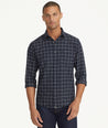 Model is wearing UNTUCKit Flannel Morisco Shirt in Navy & White Windowpane Check