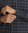 Model is wearing UNTUCKit Flannel Morisco Shirt in Navy & White Windowpane Check