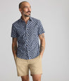 Model is wearing UNTUCKit Vintage Wash Short-Sleeve Morningside Shirt	in Navy Flower Print.