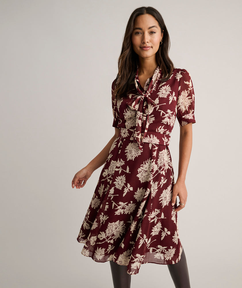 Model is wearing UNTUCKit Floral Necktie Nadine Dress.