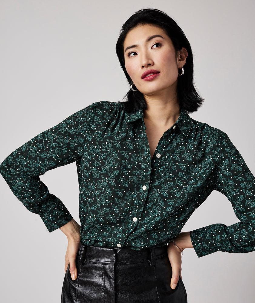 Model is wearing UNTUCKit Natalie top in green.