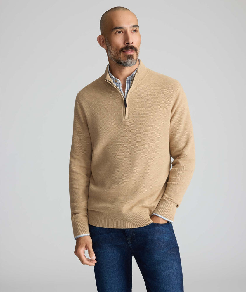 Model is wearing UNTUCKit Cotton Quarter-Zip Sweater in light brown.