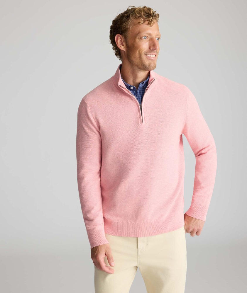 Model is wearing UNTUCKit Cotton Quarter-Zip Sweater in light pink.