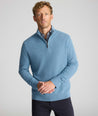 Model is wearing UNTUCKit Cotton Quarter-Zip Sweater in light blue. 