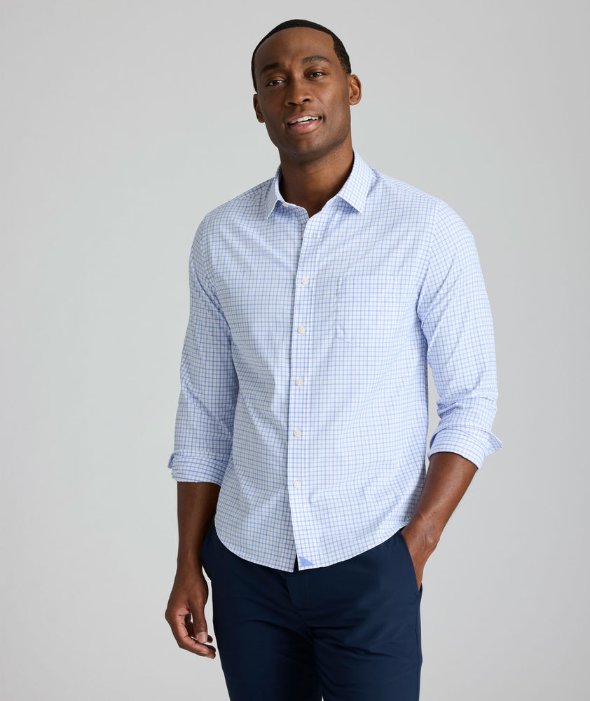Model is wearing UNTUCKIt northcliffe performance check shirt in purple. 