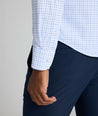 Model is wearing UNTUCKIt northcliffe performance check shirt in purple. 