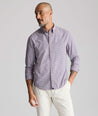 Model is wearing UNTUCKit Vintage Wash Northwell Shirt in navy. 