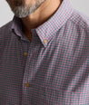 Model is wearing UNTUCKit Vintage Wash Northwell Shirt in navy. 
