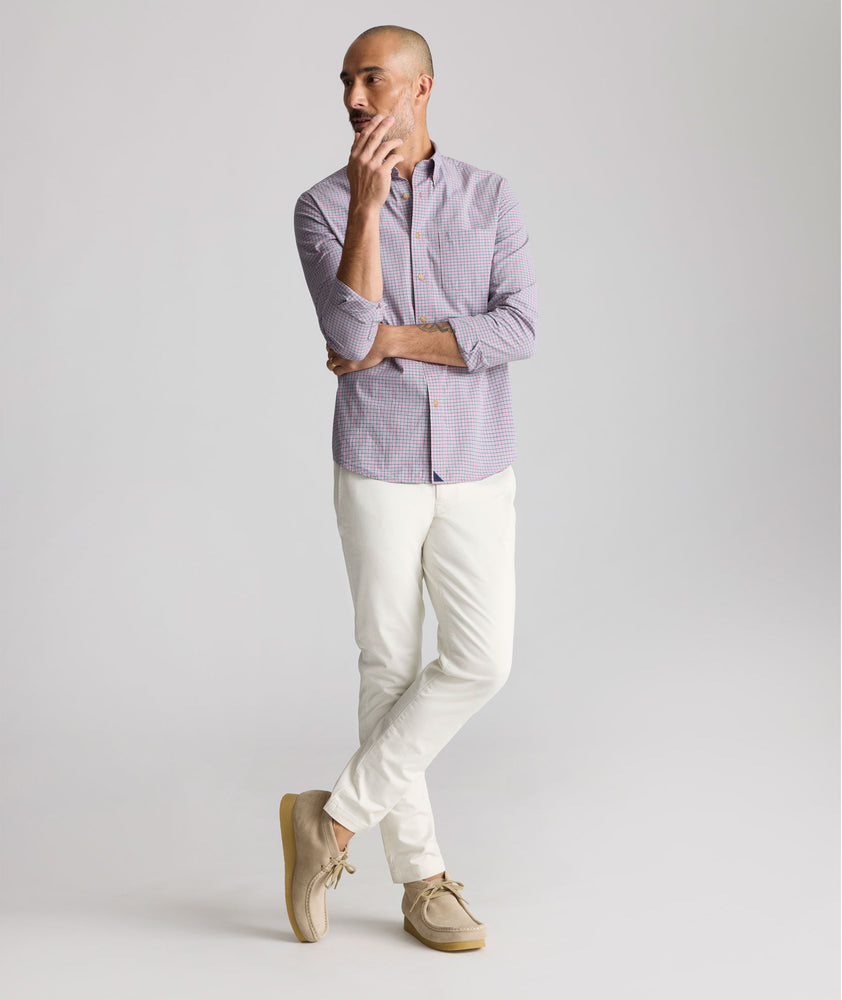 Model is wearing UNTUCKit Vintage Wash Northwell Shirt in navy. 