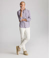 Model is wearing UNTUCKit Vintage Wash Northwell Shirt in navy. 