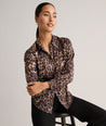 Model is wearing UNTUCKit Leopard Print Odette Shirt.