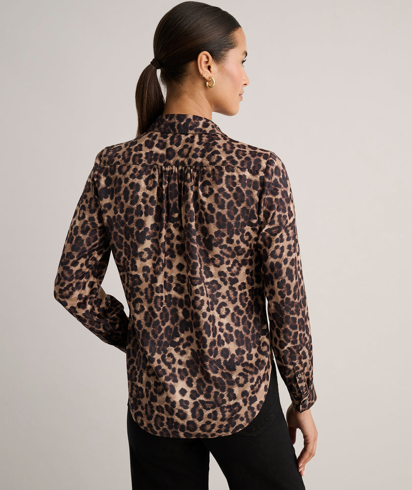 Model is wearing UNTUCKit Leopard Print Odette Shirt.