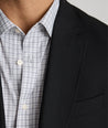 Model is wearing UNTUCKit Palazzo sport coat in black.