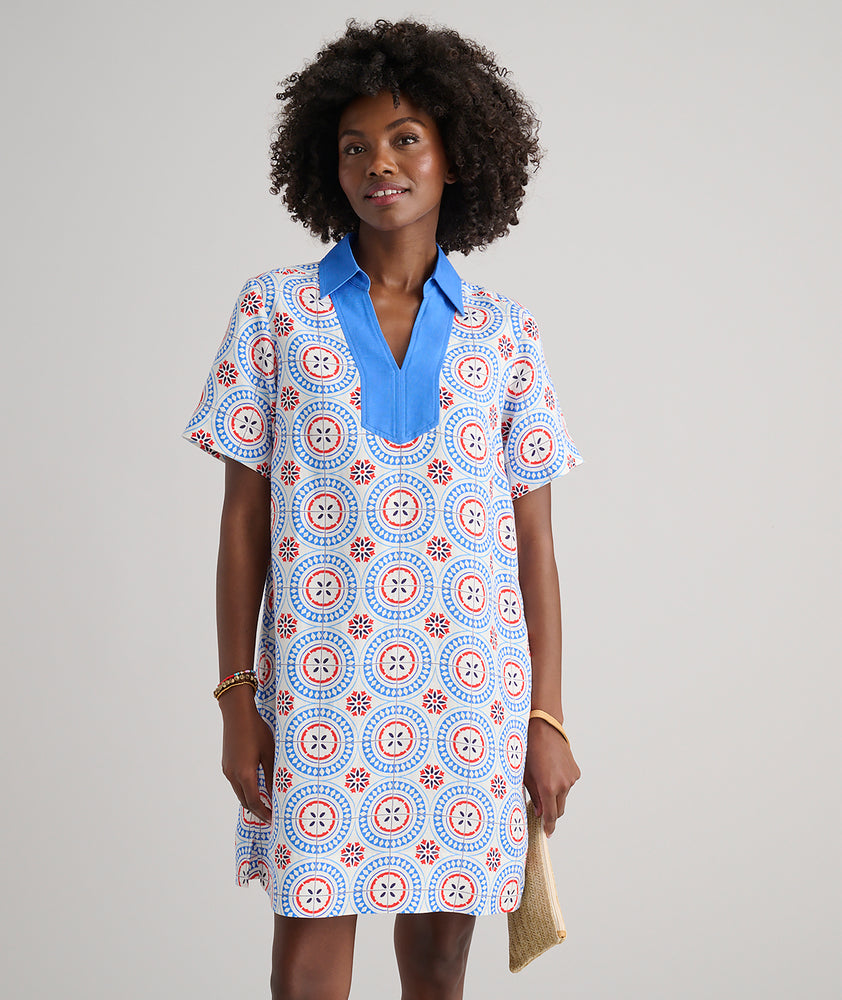 Model are wearing UNTUCKit Paola dress in printed tile blue. 