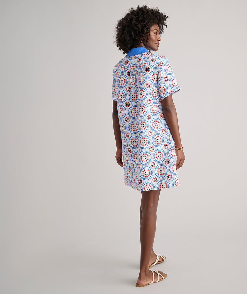 Model are wearing UNTUCKit Paola dress in printed tile blue. 