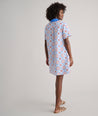 Model are wearing UNTUCKit Paola dress in printed tile blue. 
