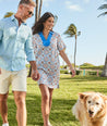Model are wearing UNTUCKit Paola dress in printed tile blue. 