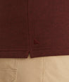 Model is wearing UNTUCKit Snap Fleece Pullover in Brick Red.