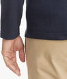 Model is wearing UNTUCKit Parkson quarter-zip sweatshirt in navy.