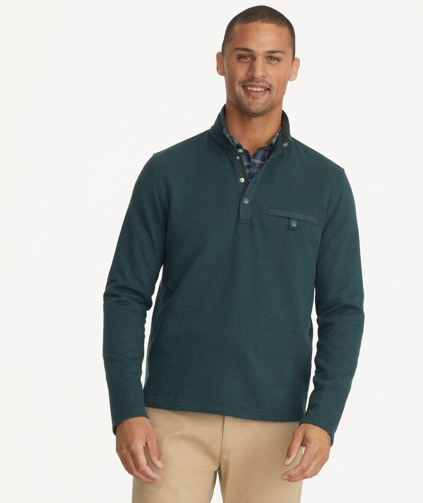 Model is wearing UNTUCKit Parkson quarter-zip in Balsam.