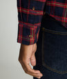 Model is wearing UNTUCKit Perking in navy and red windowpane. 