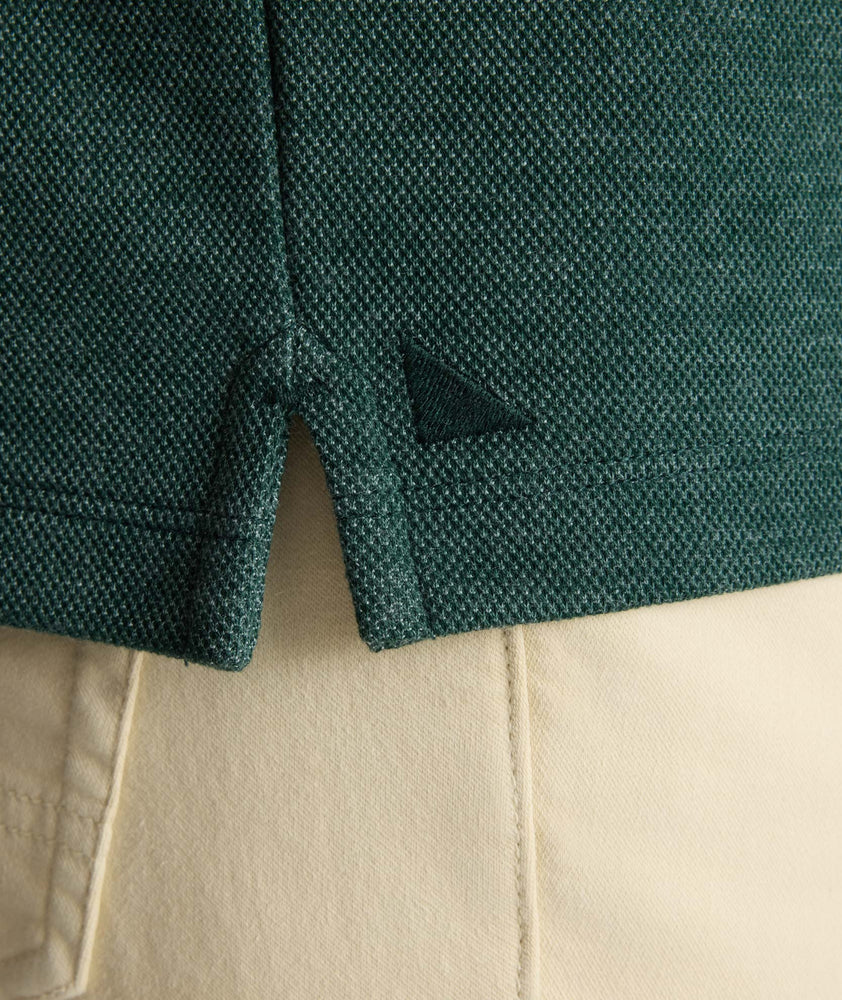 Model is wearing UNTUCKit Petrelson henley in forest green. 