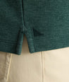 Model is wearing UNTUCKit Petrelson henley in forest green. 