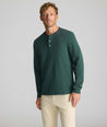 Model is wearing UNTUCKit Petrelson henley in forest green. 