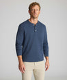Model is wearing UNTUCKit Petrelson henley in Navy. 