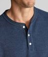 Model is wearing UNTUCKit Petrelson henley in Navy. 