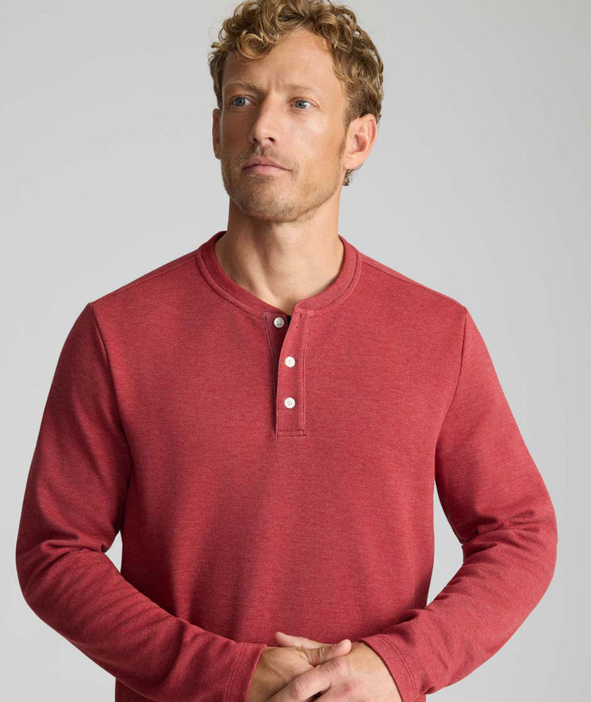 Model is wearing UNTUCKit Petrelson henley in Red. 