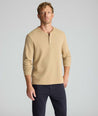Model is wearing UNTUCKit Petrelson henley in Tan. 