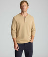 Model is wearing UNTUCKit Petrelson henley in Tan. 