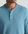 Model is wearing UNTUCKit Petrelson henley in Teal. 