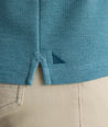 Model is wearing UNTUCKit Petrelson henley in Teal. 
