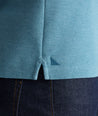 Model is wearing UNTUCKit Petrelson henley in Teal. 