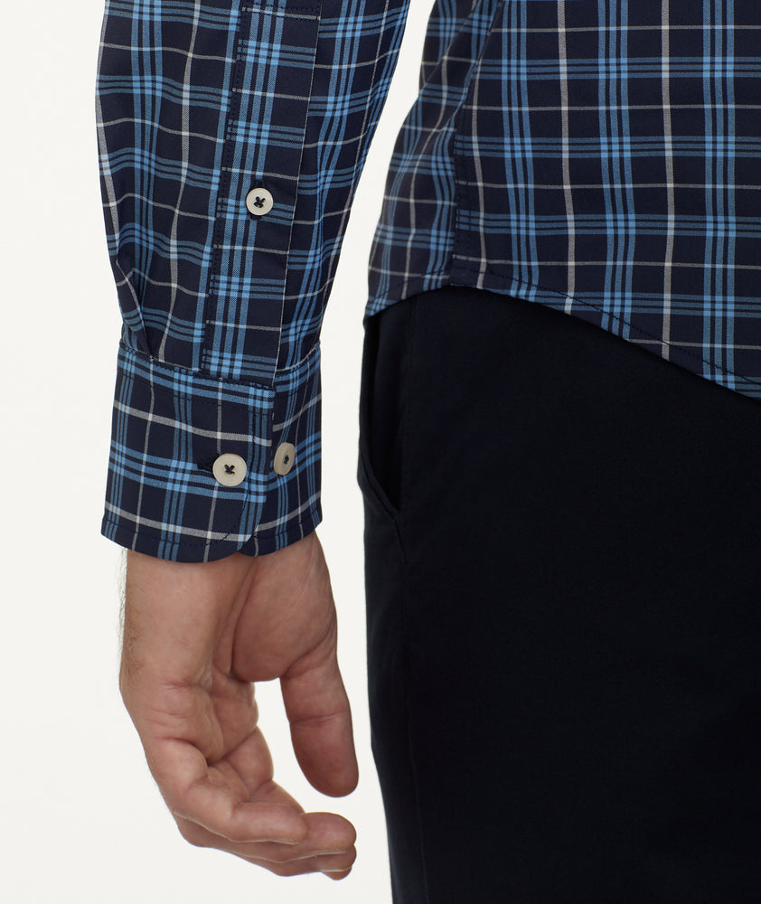Model is wearing UNTUCKit Wrinkle-Free Performance Pierro Shirt in Navy & Blue Plaid.