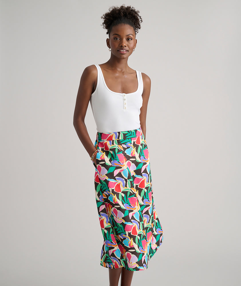 Model is wearing UNTUCKit pippa skirt in printed floral.