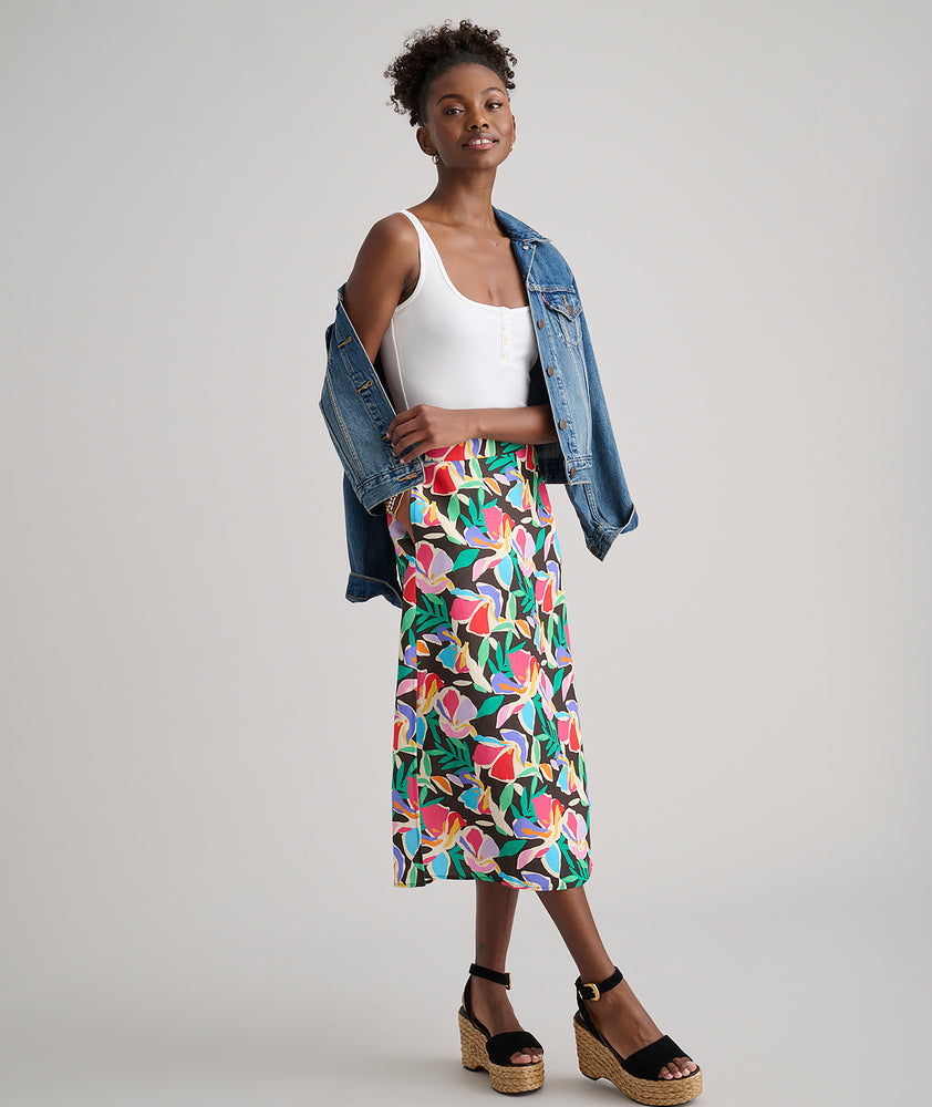 Model is wearing UNTUCKit pippa skirt in printed floral.