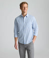 Model is wearing UNTUCKit Wrinkle-Free Pizarro Shirt in blue. 