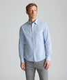 Model is wearing UNTUCKit Wrinkle-Free Pizarro Shirt in blue. 