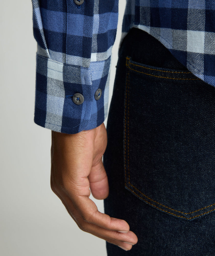 Model is wearing UNTUCKit Flannel Plenville Shirt in Peacoat.