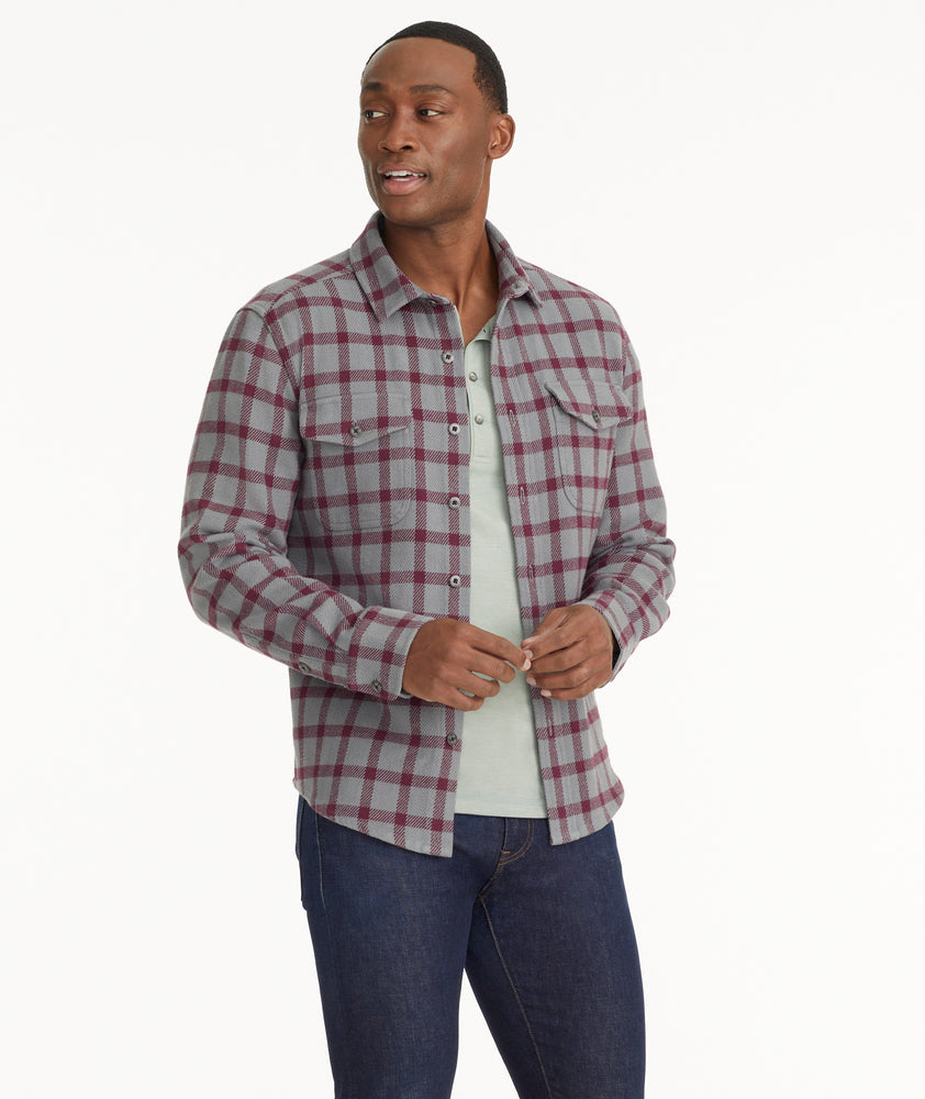 Model is wearing UNTUCKit Brushed Overshirt in Gray & Maroon Check.
