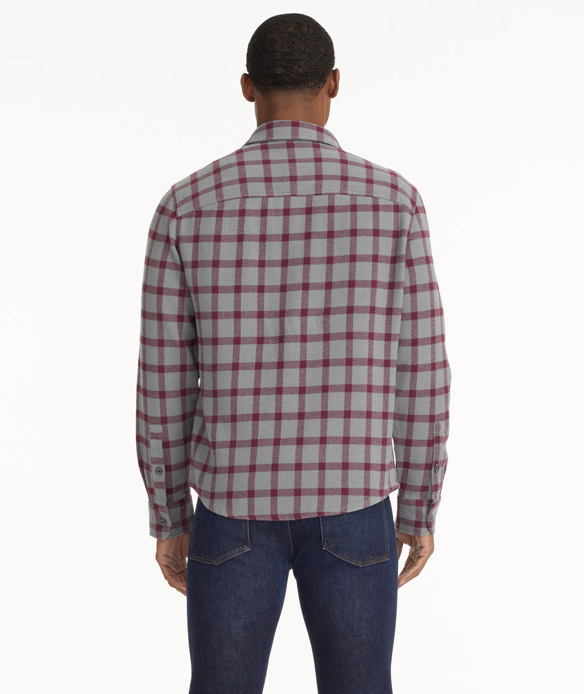 Model is wearing UNTUCKit Brushed Overshirt in Gray & Maroon Check.