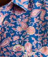 Model is wearing UNTUCKit Quarry cotton linen shirt in pink print. 