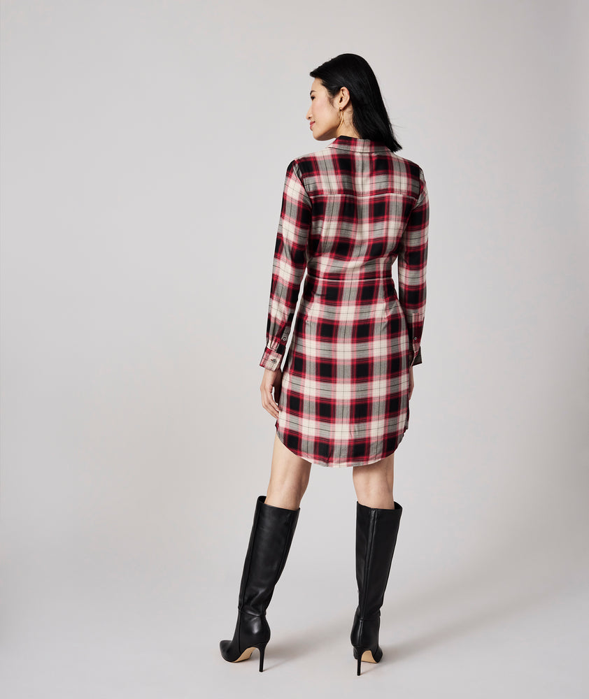 Model is wearing UNTUCKit Rachel dress in red plaid.