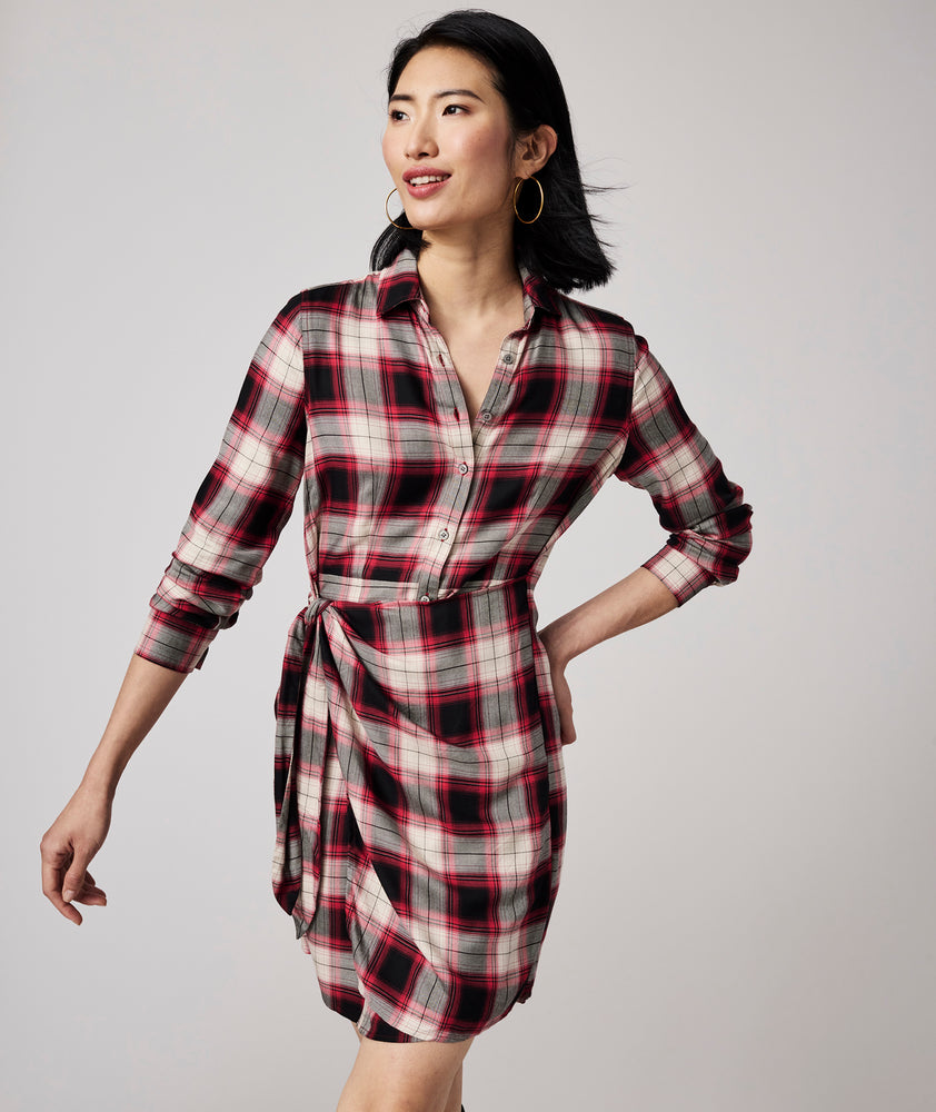 Model is wearing UNTUCKit Rachel dress in red plaid.