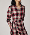 Model is wearing UNTUCKit Rachel dress in red plaid.