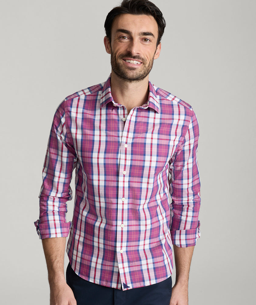 Model is wearing UNTUCKit rafferty shirt in plaid red. 